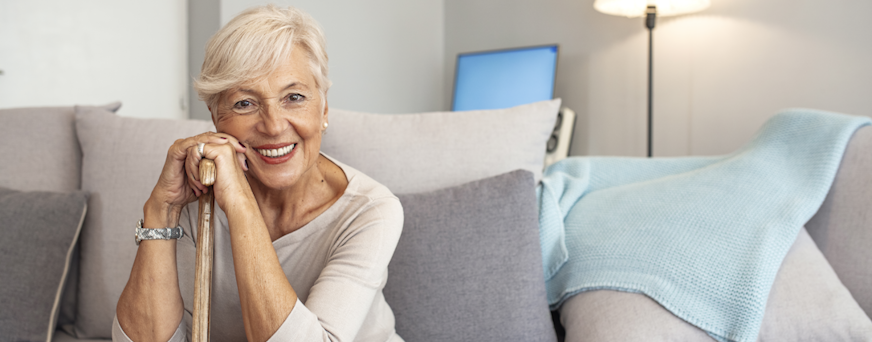 Life Assure Senior Woman Sitting In Chair And Laughing With Caregiver Nurse Hero